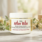  Herby After Bite cream jar on a table with greenery, offering instant relief from mosquito and ant bites.